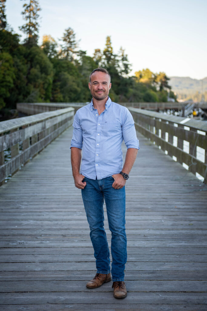 Sean Lewis - Registered Psychotherapist at Introspectus Counselling standing on bridge